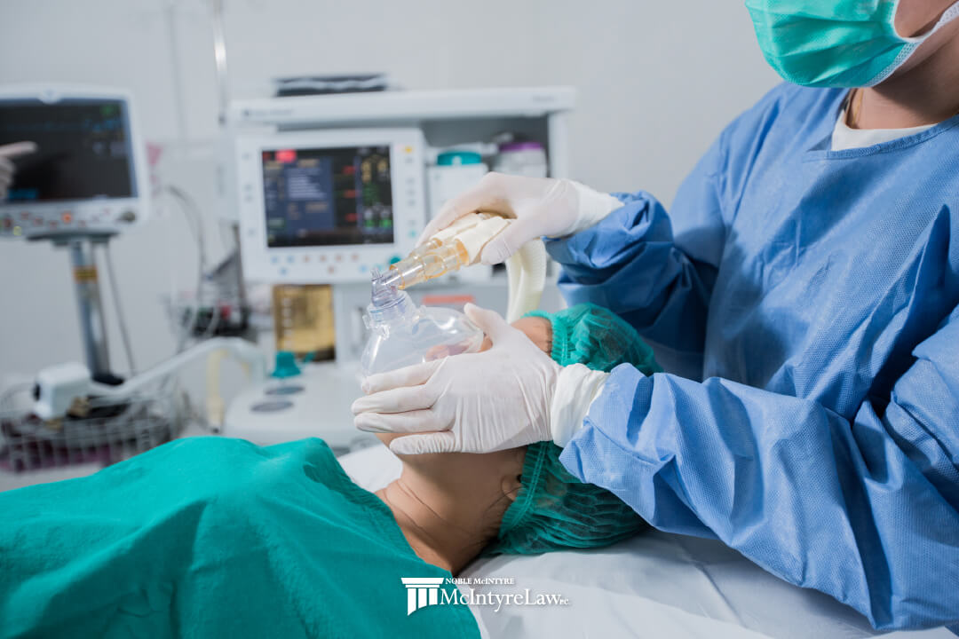 Patient being put under anesthesia in a medical setting