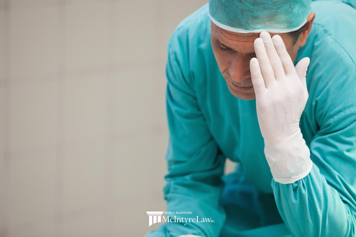 Surgeon holding his head